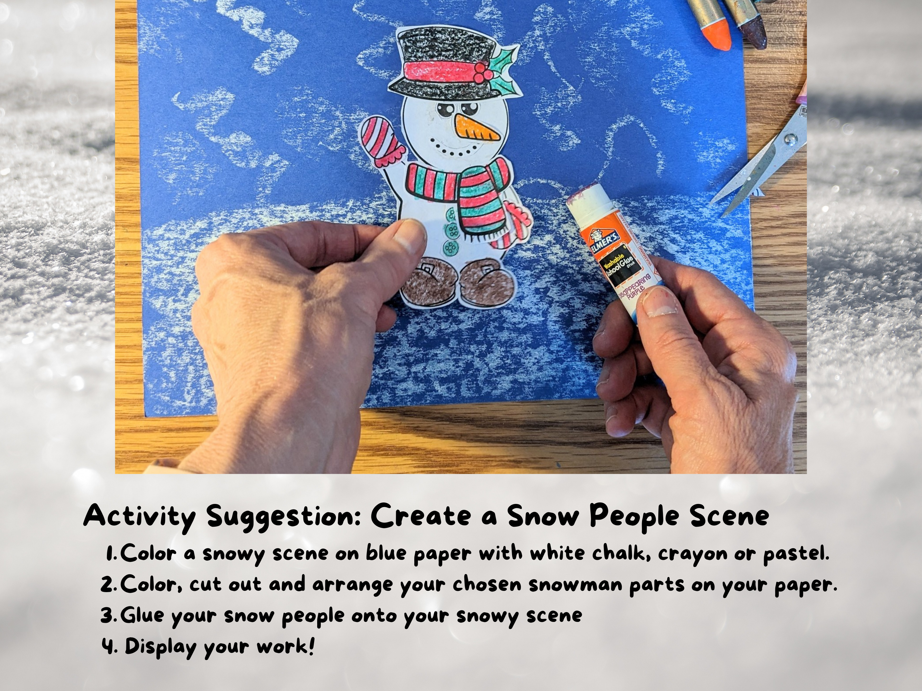 Build a Snowman Craft: hands gluing pieces of snowman to blue paper